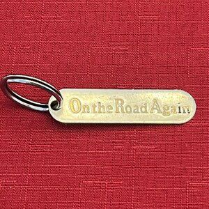 Vintage Russ Keychain Brass Metal "On The Road Again"